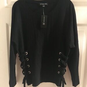 I love this sweater. 1 time use. The side has a bejewel tie down with bow.